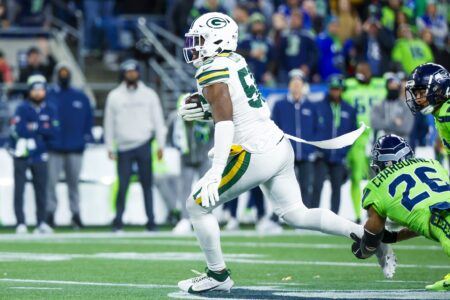 Dec 15, 2024; Seattle, Washington, USA; Green Bay Packers linebacker Edgerrin Cooper (56) returns an interception against the Seattle Seahawks during the fourth quarter at Lumen Field. Mandatory Credit: Joe Nicholson-Imagn Images