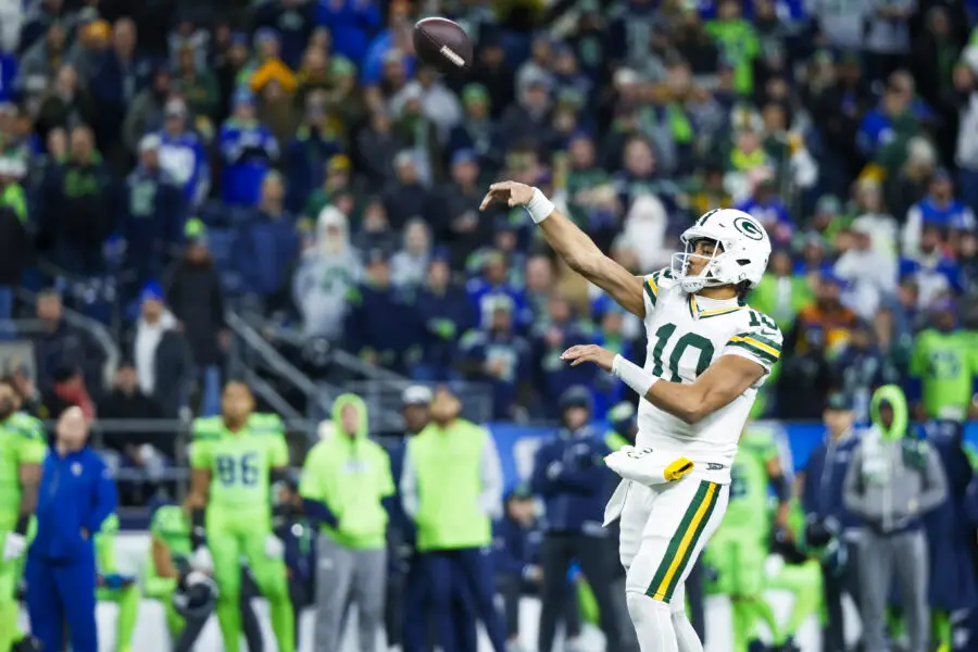 Dec 15, 2024; Seattle, Washington, USA; Green Bay Packers quarterback Jordan Love (10) throws a touchdown pass against the Seattle Seahawks during the fourth quarter at Lumen Field. Mandatory Credit: Joe Nicholson-Imagn Images