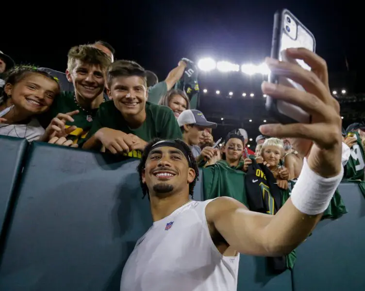 Green Bay Packers quarterback Jordan Love takes a selfie with fans during Family Night on Saturday, August 3, 2024, at Lambeau Field in Green Bay, Wis. Tork Mason/USA TODAY NETWORK-Wisconsin