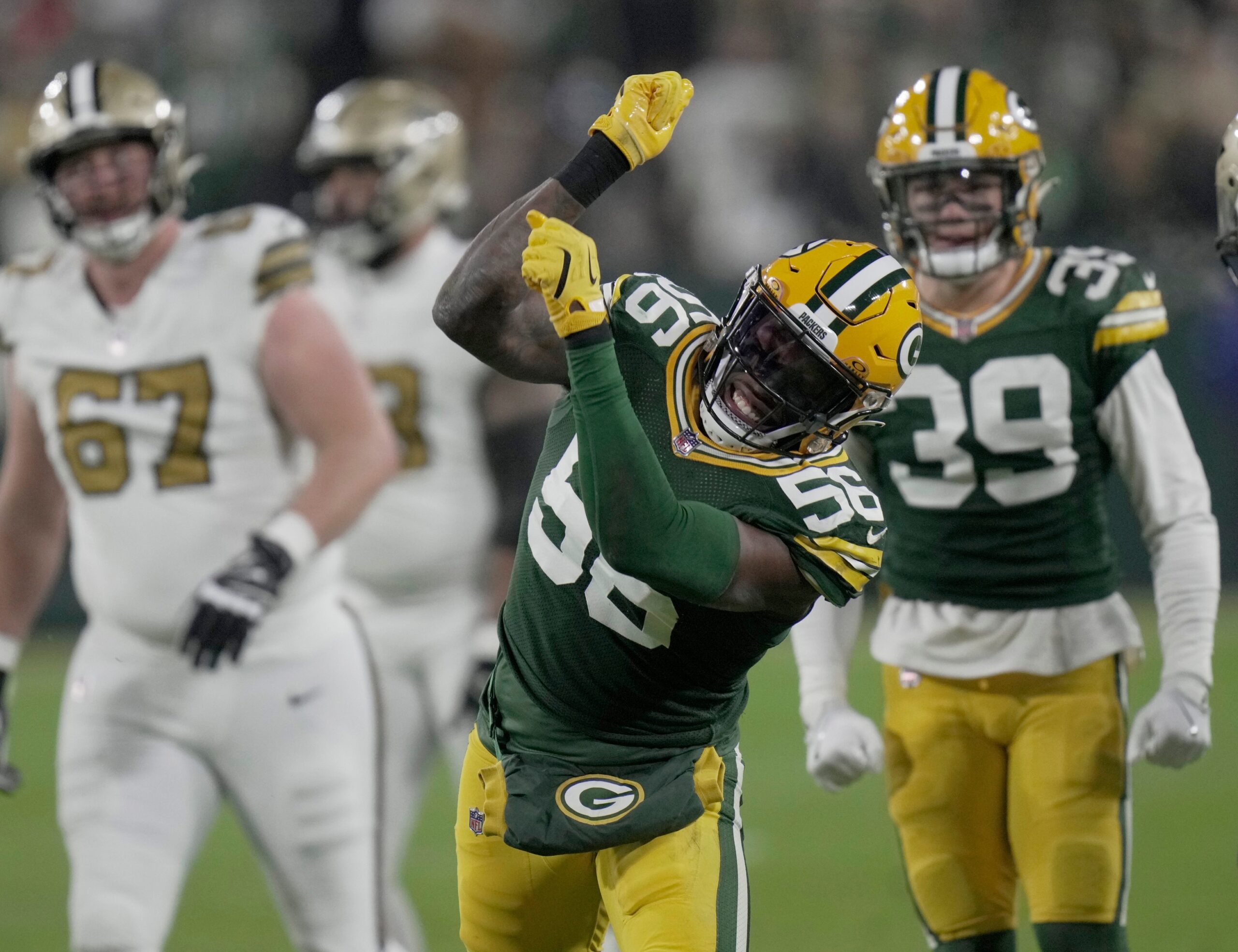 Green Bay Packers linebacker Edgerrin Cooper (56) celebrates a tackle for a three-yard loss during the second quarter of their game Monday, December 23, 2024 at Lambeau Field in Green Bay, Wisconsin. The Green Bay Packers beat the New Orleans Saints 34-0. © Mark Hoffman/Milwaukee Journal Sentinel / USA TODAY NETWORK via Imagn Images