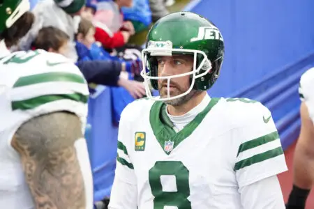 Dec 29, 2024; Orchard Park, New York, USA; New York Jets quarterback Aaron Rodgers (8) walks out onto the field prior to the game against the Buffalo Bills at Highmark Stadium. Mandatory Credit: Gregory Fisher-Imagn Images