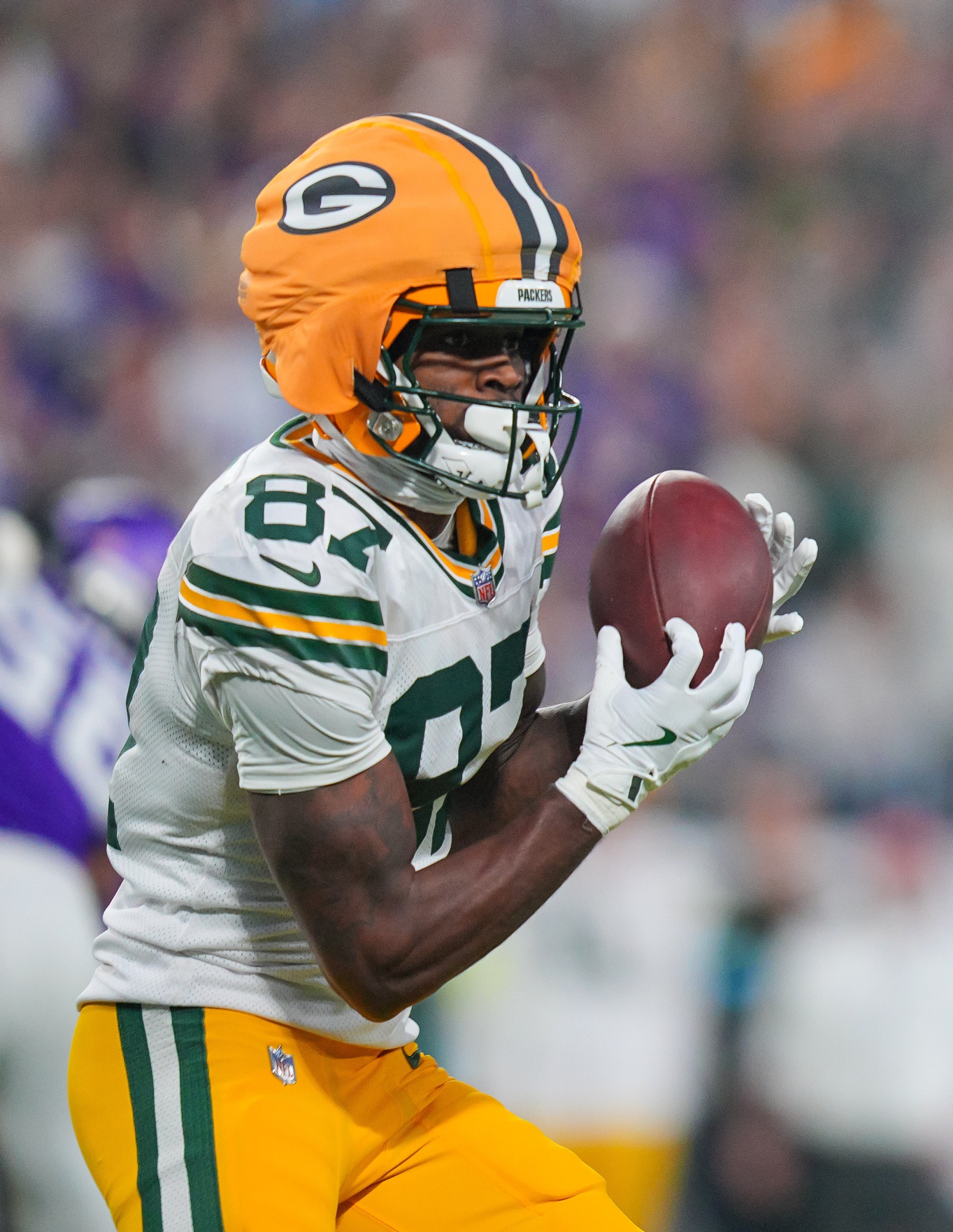 Dec 29, 2024; Minneapolis, Minnesota, USA; Green Bay Packers wide receiver Romeo Doubs (87) catches a pass against Minnesota Vikings in the second quarter at U.S. Bank Stadium. Mandatory Credit: Brad Rempel-Imagn Images