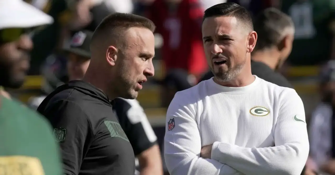 Oct 20, 2024; Green Bay, Wisconsin, USA; Green Bay Packers defensive coordinator Jeff Hafley, left, talks with head coach Matt LaFleur before their game against the Houston Texans at Lambeau Field. Mandatory Credit: Mark Hoffman/USA TODAY Network via Imagn Images