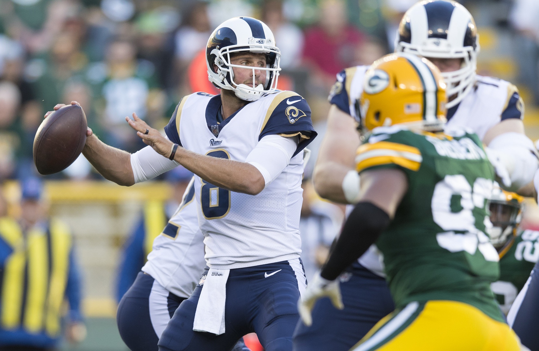 Aug 31, 2017; Green Bay, WI, USA; Los Angeles Rams quarterback Dan Orlovsky (8) throws a pass during the first quarter against the Green Bay Packers at Lambeau Field. Mandatory Credit: Jeff Hanisch-Imagn Images