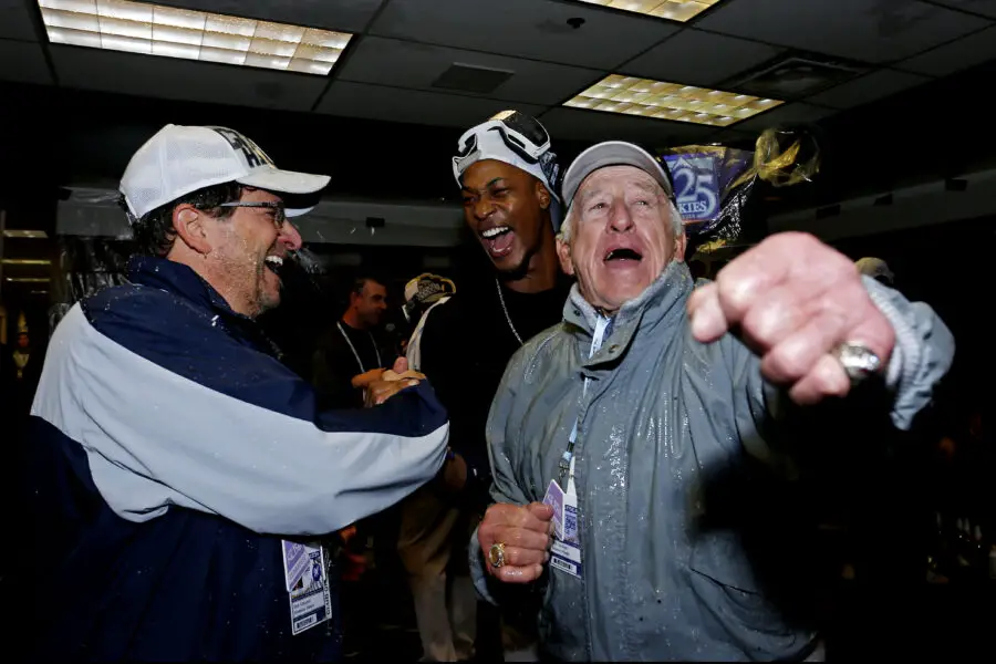 Oct 7, 2018; Denver, CO, USA; The Milwaukee Brewers celebrate with broadcaster Bob Uecker after beating the Colorado Rockies in game three of the 2018 NLDS playoff baseball series at Coors Field. Mandatory Credit: Russell Lansford-Imagn Images