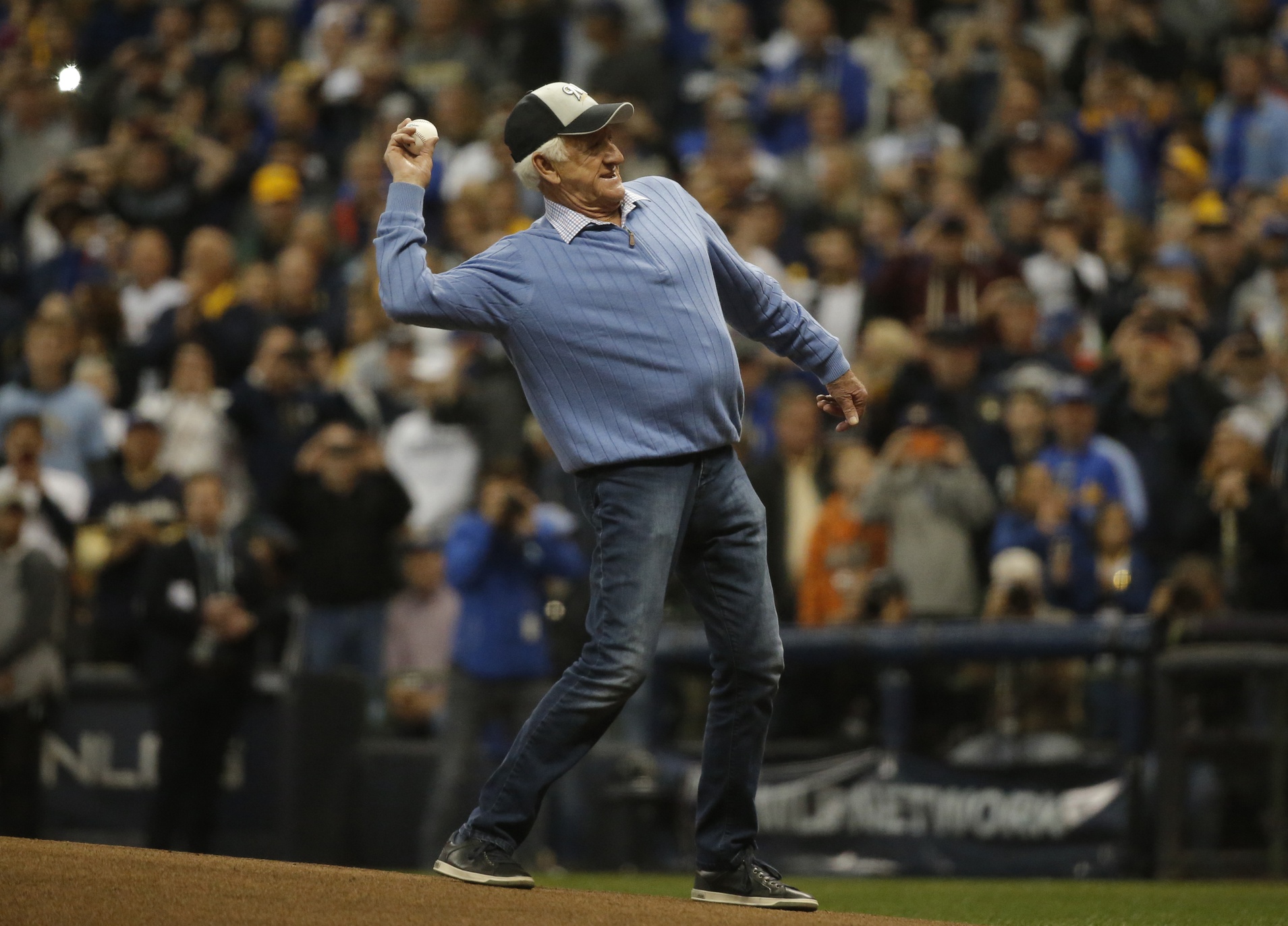 Oct 12, 2018; Milwaukee, WI, USA; Bob Uecker throws out a ceremonial first pitch before game one of the 2018 NLCS playoff baseball series between the Milwaukee Brewers and the Los Angeles Dodgers at Miller Park. Mandatory Credit: Jon Durr-Imagn Images