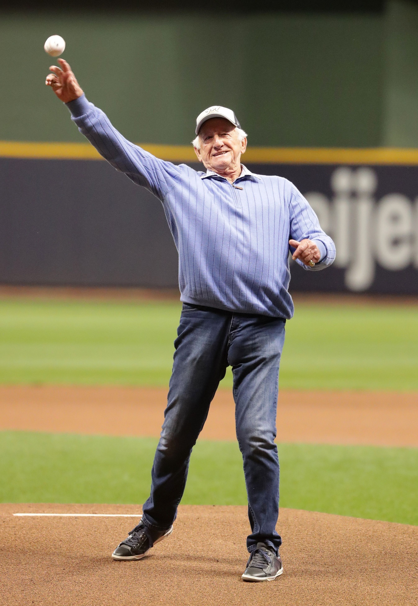 Legendary Brewers radio broadcaster Bob Uecker unleashes the ceremonial first pitcher before Game 1 of the NLCS against the Dodgers on Friday night. © Mark Hoffman, Milwaukee Journal Sentinel