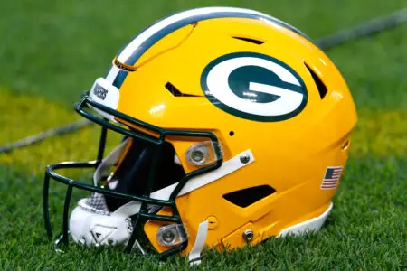 Sep 20, 2021; Green Bay, Wisconsin, USA; A Green Bay Packers helmet rests on the sidelines during warmups prior to the game against the Detroit Lions at Lambeau Field. Mandatory Credit: Jeff Hanisch-Imagn Images