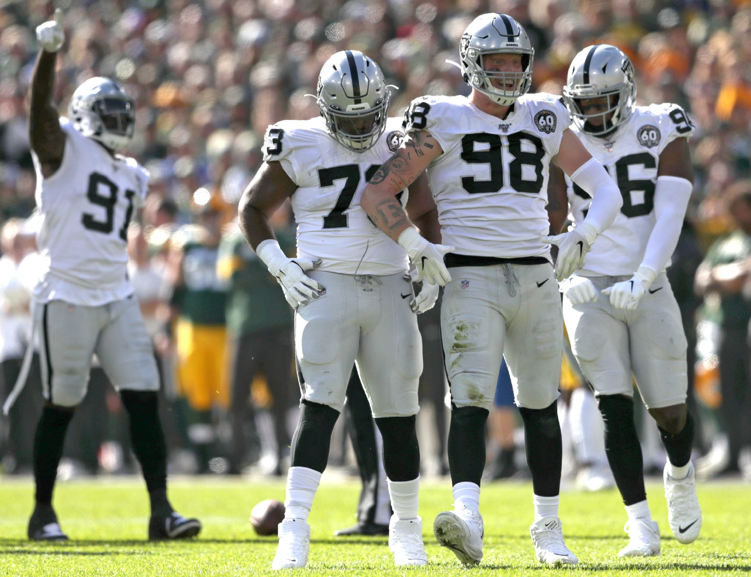 Oakland Raiders defensive end Maxx Crosby (98) celebrates after sacking Green Bay Packers quarterback Aaron Rodgers (12) during their football game on Oct. 20, 2019, at Lambeau Field in Green Bay.© William Glasheen/USA TODAY NETWORK-Wisconsin / USA TODAY NETWORK