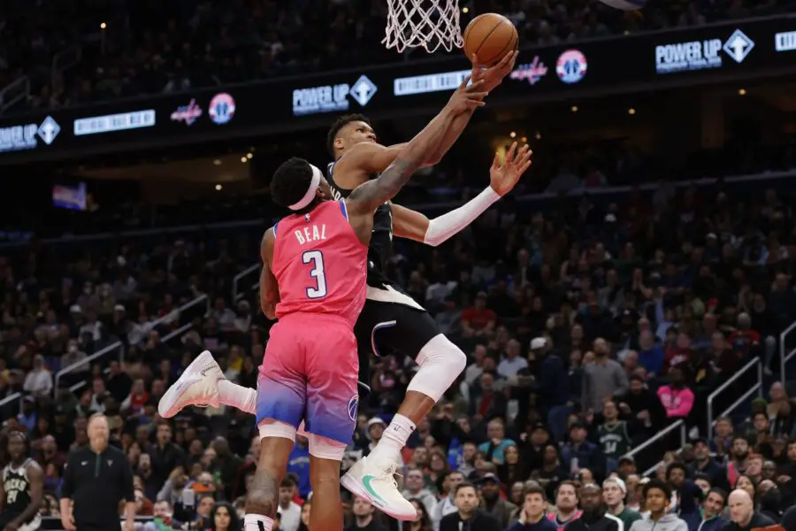 Mar 5, 2023; Washington, District of Columbia, USA; Milwaukee Bucks forward Giannis Antetokounmpo (34) is fouled while driving to the base by Washington Wizards guard Bradley Beal (3) in the fourth quarter at Capital One Arena. Mandatory Credit: Geoff Burke-Imagn Images