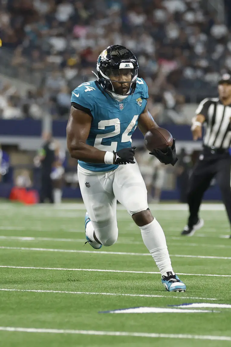 Aug 12, 2023; Arlington, Texas, USA; Jacksonville Jaguars running back Snoop Conner (24) runs the ball in the fourth quarter Dallas Cowboys at AT&T Stadium. Mandatory Credit: Tim Heitman-Imagn Images Packers