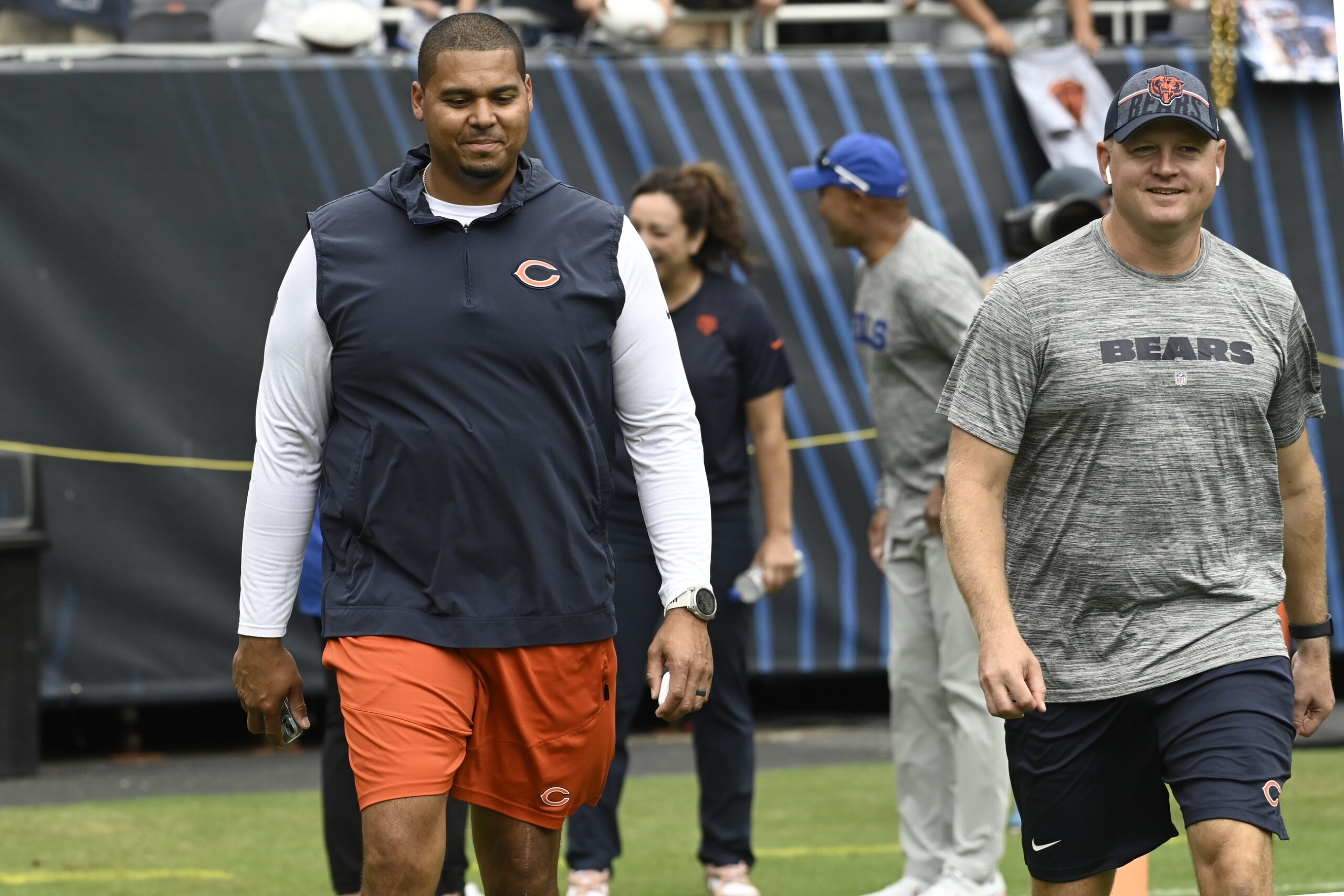 Aug 26, 2023; Chicago, Illinois, USA; Chicago Bears General Manager Ryan Poles, left, and Luke Getsy, Offensive Coordinator walk the field before the team s game against the Buffalo Bills at Soldier Field. Mandatory Credit: Matt Marton-Imagn Images