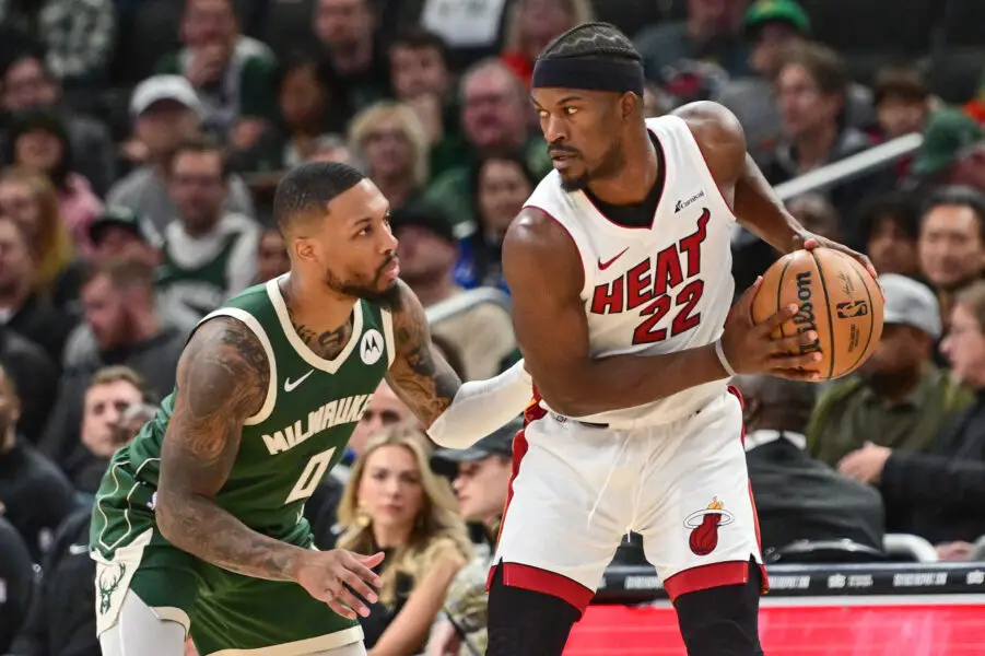 Oct 30, 2023; Milwaukee, Wisconsin, USA; Milwaukee Bucks guard Damian Lillard (0) guards Miami Heat center Jimmy Butler (22) in the second quarter at Fiserv Forum. Mandatory Credit: Benny Sieu-Imagn Images