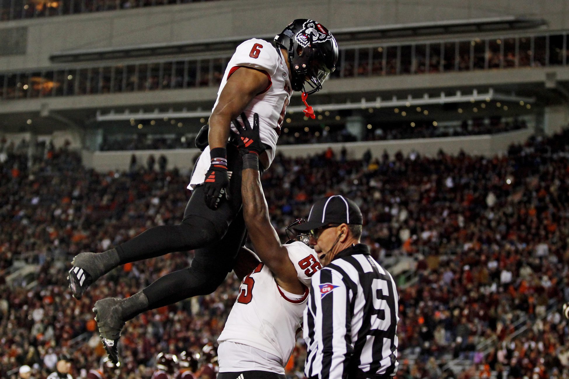 Nov 18, 2023; Blacksburg, Virginia, USA; North Carolina State Wolfpack tight end Trent Pennix (6) celebrates scoring a touchdown against the Virginia Tech Hokies at Lane Stadium. Mandatory Credit: Peter Casey-Imagn Images