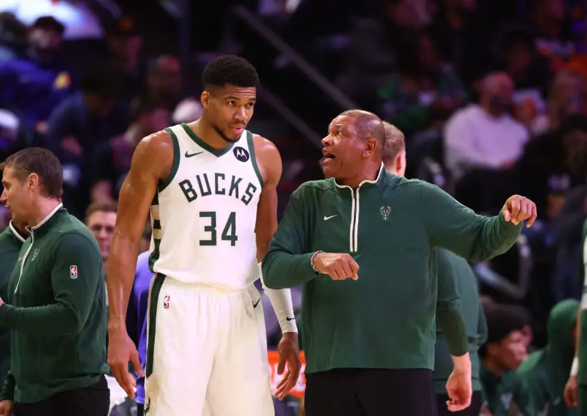 Feb 6, 2024; Phoenix, Arizona, USA; Milwaukee Bucks head coach Doc Rivers talks to forward Giannis Antetokounmpo (34) against the Phoenix Suns at Footprint Center. Mandatory Credit: Mark J. Rebilas-Imagn Images