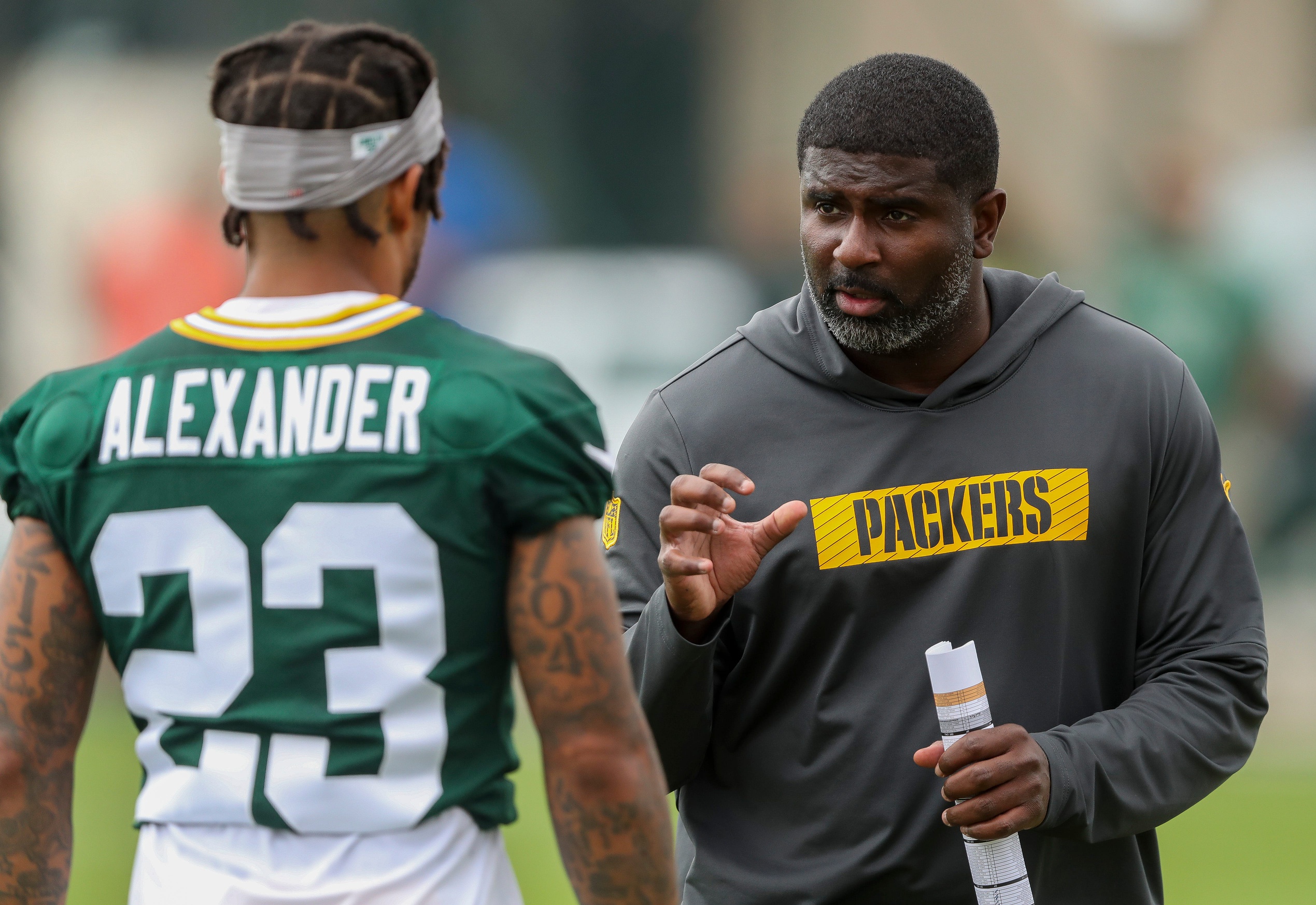 Green Bay Packers defensive passing game coordinator Derrick Ansley gives instruction to cornerback Jaire Alexander (23) on Wednesday, July 24, 2024, at Ray Nitschke Field in Green Bay, Wis. Tork Mason/USA TODAY NETWORK-Wisconsin