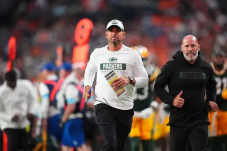 Aug 18, 2024; Denver, Colorado, USA; Green Bay Packers head coach Matt LaFleur leaves the field in the first half against the Denver Broncos at Empower Field at Mile High. Mandatory Credit: Ron Chenoy-Imagn Images