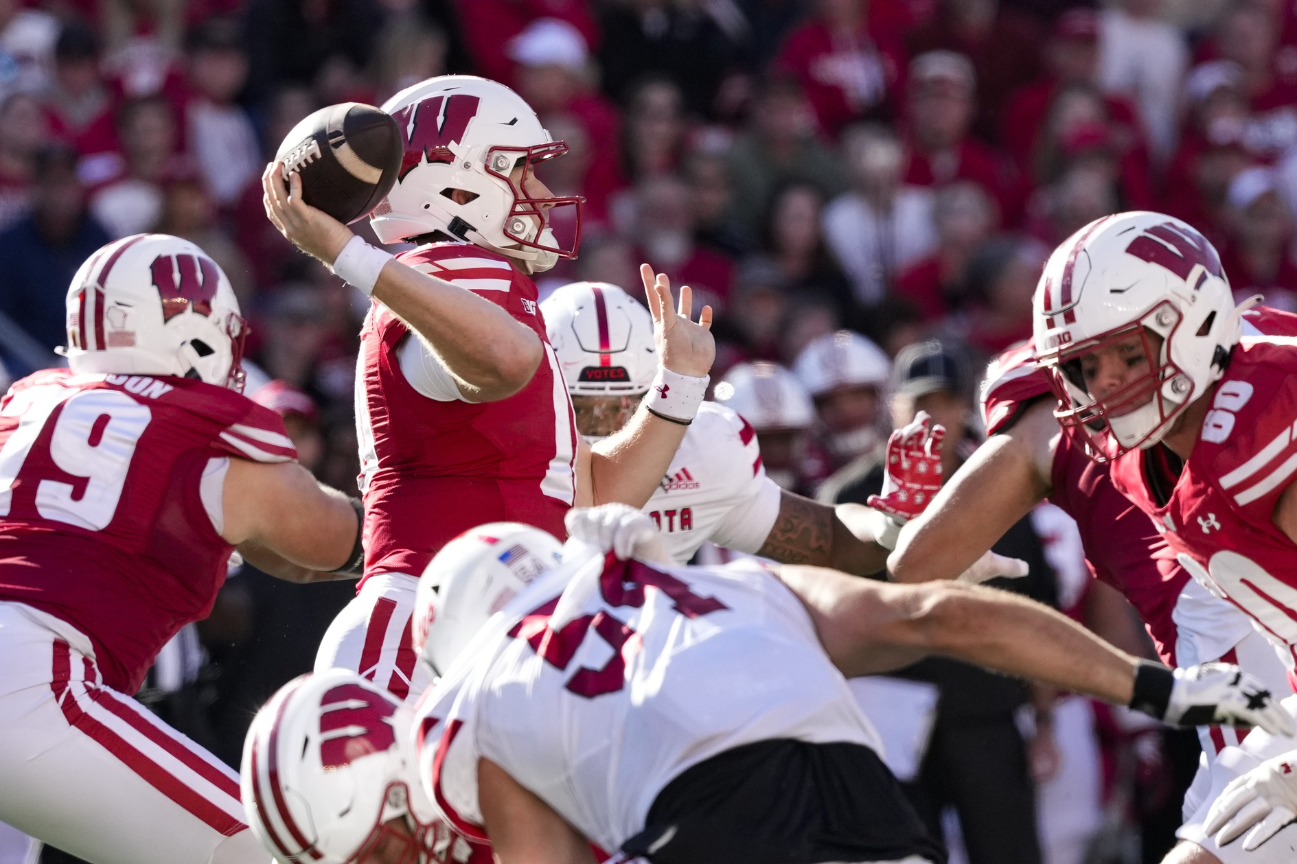 Sep 7, 2024; Madison, Wisconsin, USA; Wisconsin Badgers quarterback Tyler Van Dyke (10) throws a pass during the third quarter against the South Dakota Coyotes at Camp Randall Stadium. Mandatory Credit: Jeff Hanisch-Imagn Images