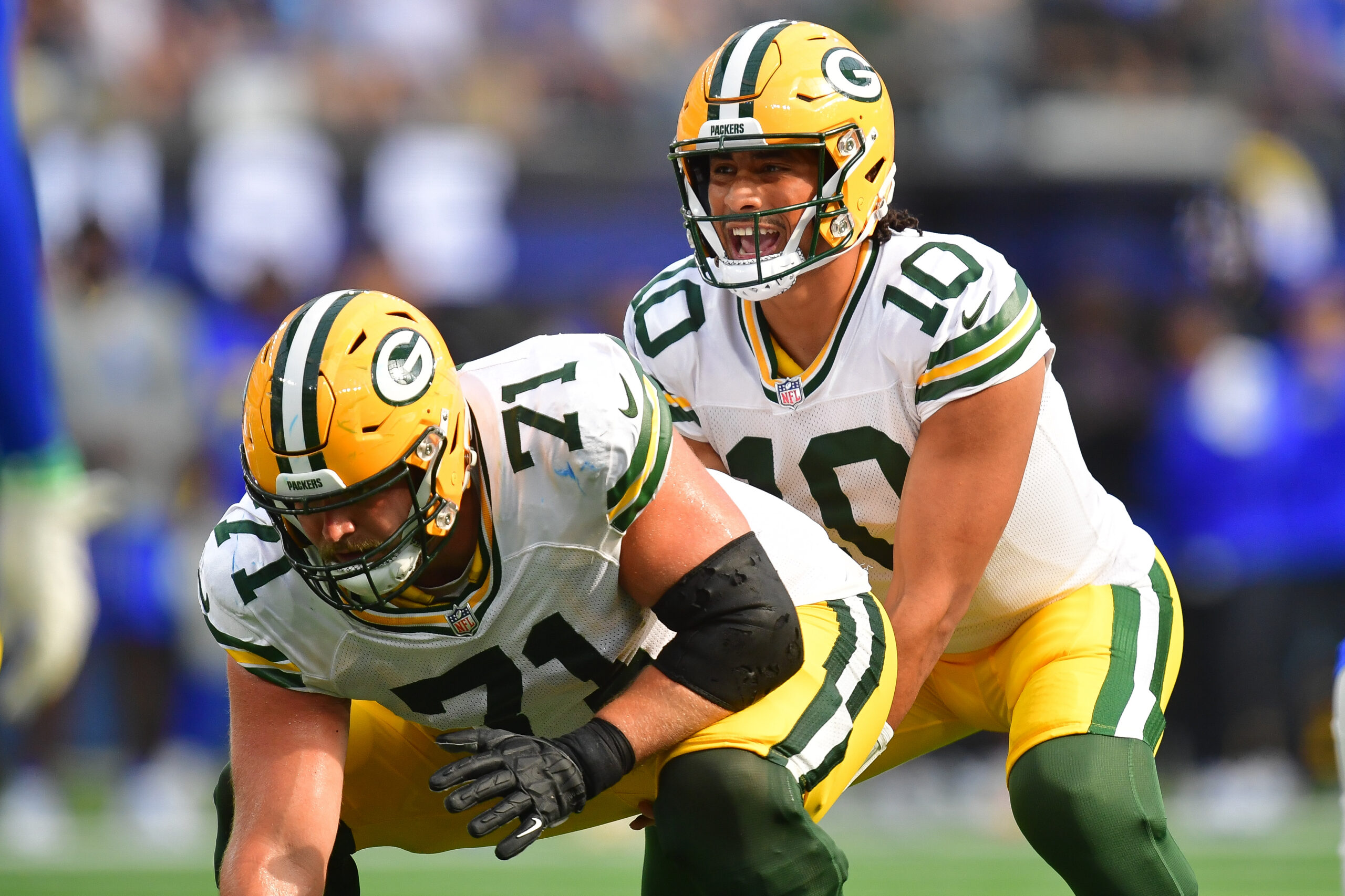 Oct 6, 2024; Inglewood, California, USA; Green Bay Packers quarterback Jordan Love (10) under center with center Josh Myers (71) against the Los Angeles Rams during the second half at SoFi Stadium. Mandatory Credit: Gary A. Vasquez-Imagn Images