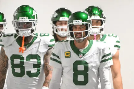 Oct 20, 2024; Pittsburgh, Pennsylvania, USA; New York Jets quarterback Aaron Rodgers (8) walks onto the field for a game against the Pittsburgh Steelers at Acrisure Stadium. Mandatory Credit: Barry Reeger-Imagn Images