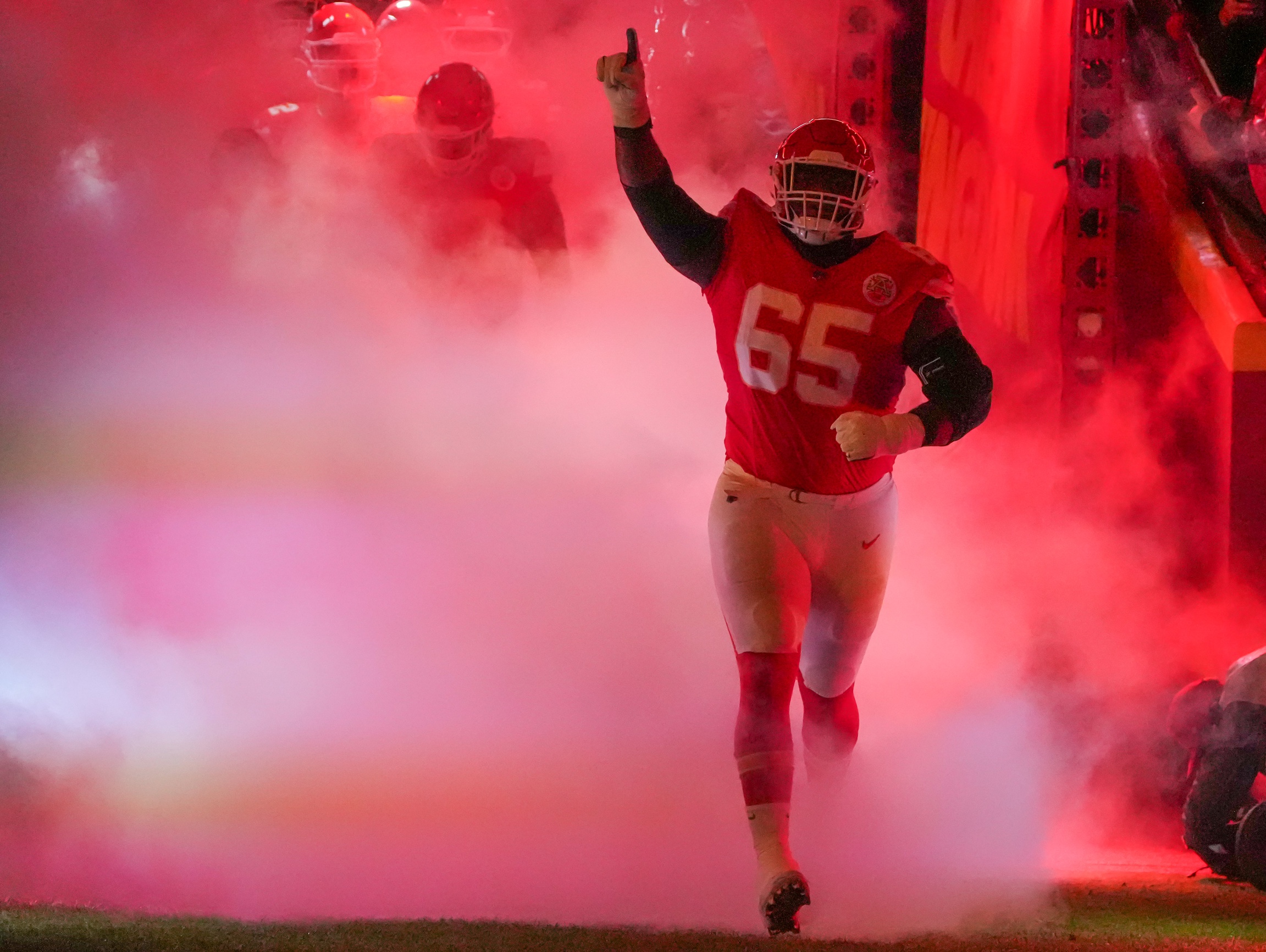 Nov 4, 2024; Kansas City, Missouri, USA; Kansas City Chiefs guard Trey Smith (65) is introduced against the Tampa Bay Buccaneers prior to a game at GEHA Field at Arrowhead Stadium. Mandatory Credit: Denny Medley-Imagn Images Packers