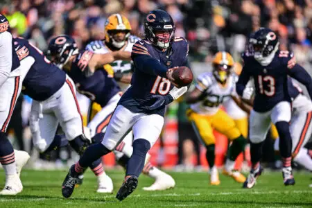 Nov 17, 2024; Chicago, Illinois, USA; Chicago Bears quarterback Caleb Williams (18) fakes a hand off against the Green Bay Packers during the first quarter at Soldier Field. Mandatory Credit: Daniel Bartel-Imagn Images