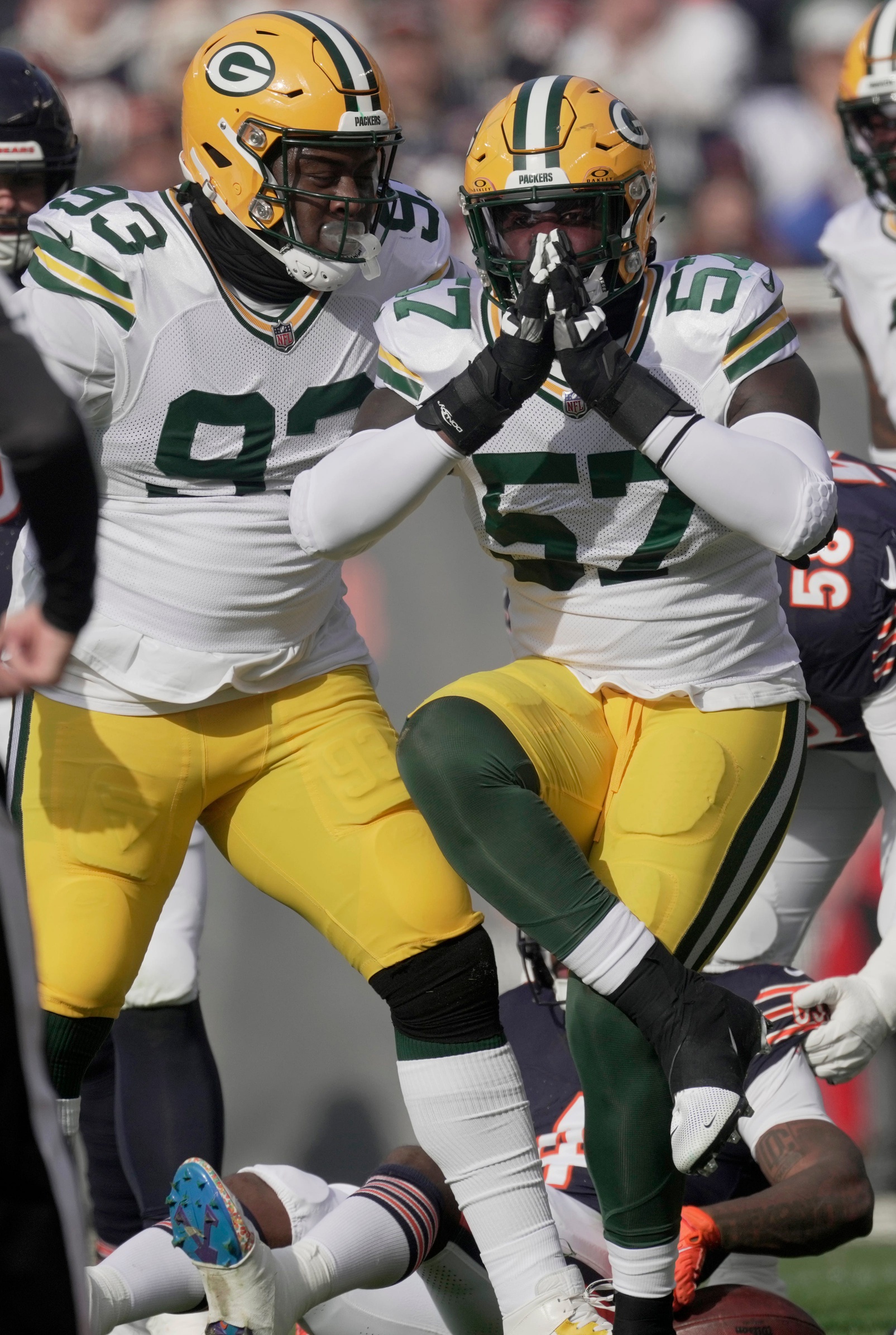 Nov 17, 2024; Chicago, Illinois, USA; Green Bay Packers defensive end Brenton Cox Jr. (57) celebrates his tackle for a three-yard loss during the first quarter of their game against the Chicago Bears Sunday, November 17, 2024 at Soldier Field in Chicago, Illinois. Mandatory Credit: Mark Hoffman/USA TODAY Network via Imagn Images