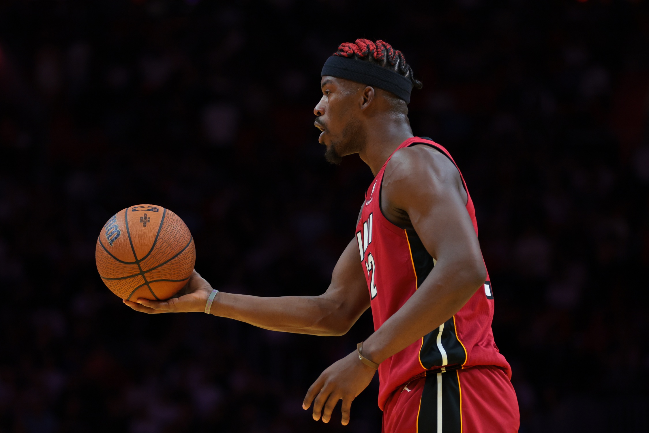 Nov 26, 2024; Miami, Florida, USA; Miami Heat forward Jimmy Butler (22) reacts with the basketball against the Milwaukee Bucks during the third quarter at Kaseya Center. Mandatory Credit: Sam Navarro-Imagn Images