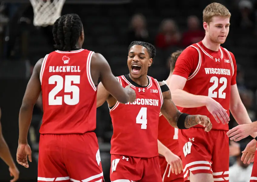 Wisconsin Badgers guards John Blackwell (25) and Kamari McGee (4) celebrating