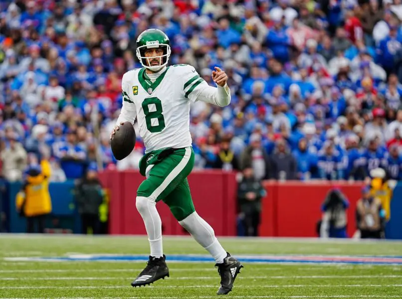 New York Jets quarterback Aaron Rodgers (8) breaks away on a fake hand-off looking for an open receiver during first half action at the Bills home game against the New York Jets at Highmark Stadium in Orchard Park on Dec. 29, 2024. His pass was incomplete. Packers