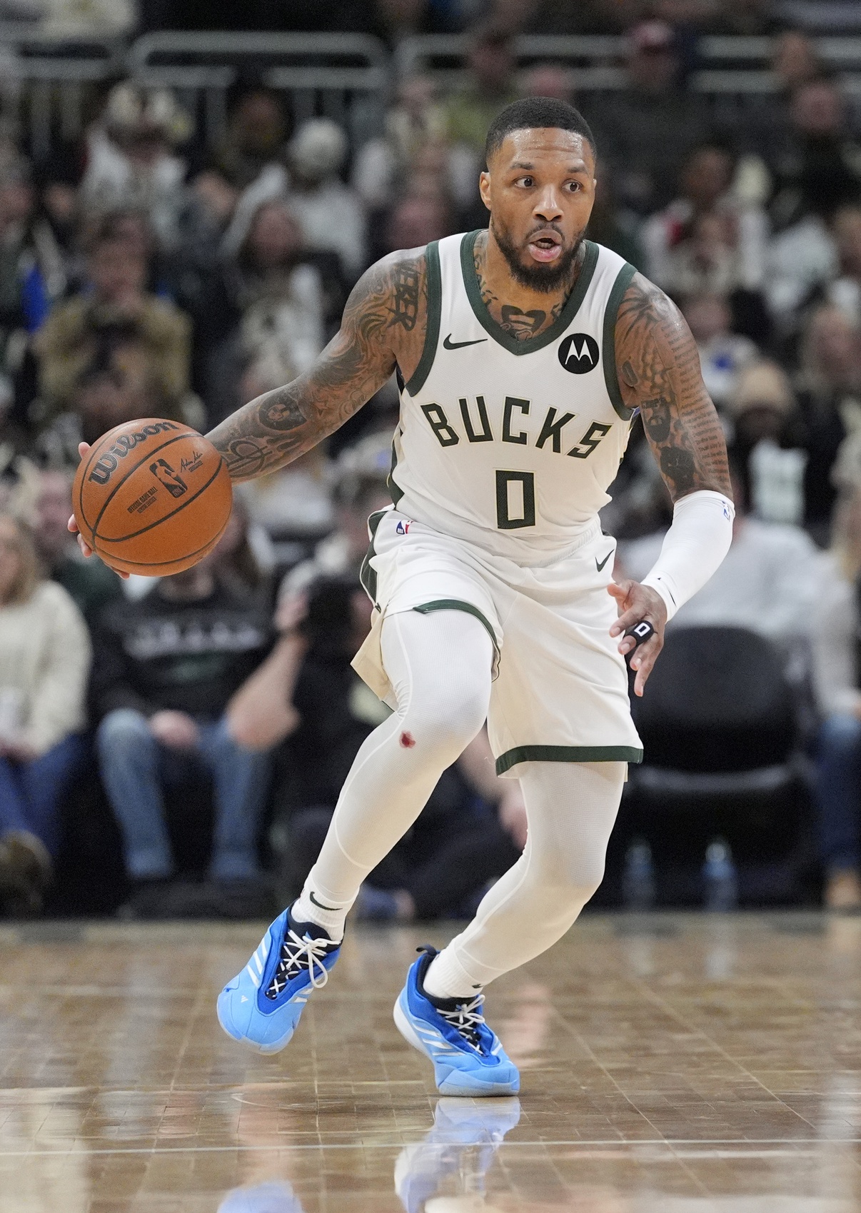 Jan 2, 2025; Milwaukee, Wisconsin, USA; Milwaukee Bucks guard Damian Lillard (0) brings the ball up the court against Brooklyn Nets win the first half at Fiserv Forum. Mandatory Credit: Michael McLoone-Imagn Images