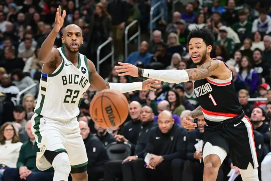 Portland Trail Blazers. Anfernee Simons (1) passes the ball away from Milwaukee Bucks forward Khris Middleton (22)