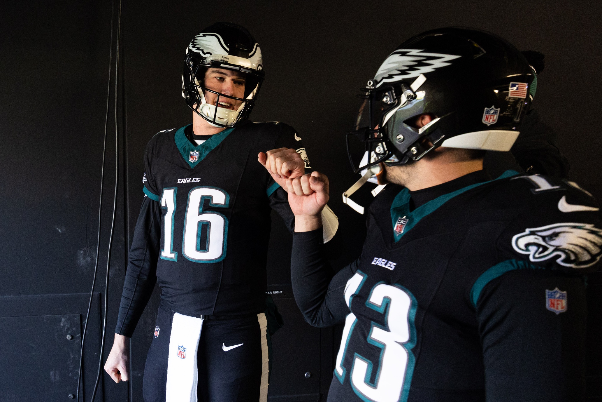 Jan 5, 2025; Philadelphia, Pennsylvania, USA; Philadelphia Eagles quarterbacks Tanner McKee (16) and Ian Book (13) walk out of the tunnel for warm ups against the New York Giants at Lincoln Financial Field. Mandatory Credit: Bill Streicher-Imagn Images