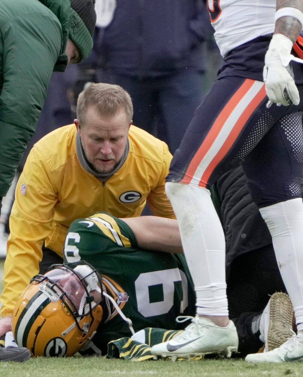 Green Bay Packers wide receiver Christian Watson (9) is ended to after being injured during the first quarter of their game Sunday, January 5, 2025 at Lambeau Field in Green Bay, Wisconsin. The Chicago Bears beat the Green Bay Packers 24-22. © Mark Hoffman/Milwaukee Journal Sentinel / USA TODAY NETWORK via Imagn Images