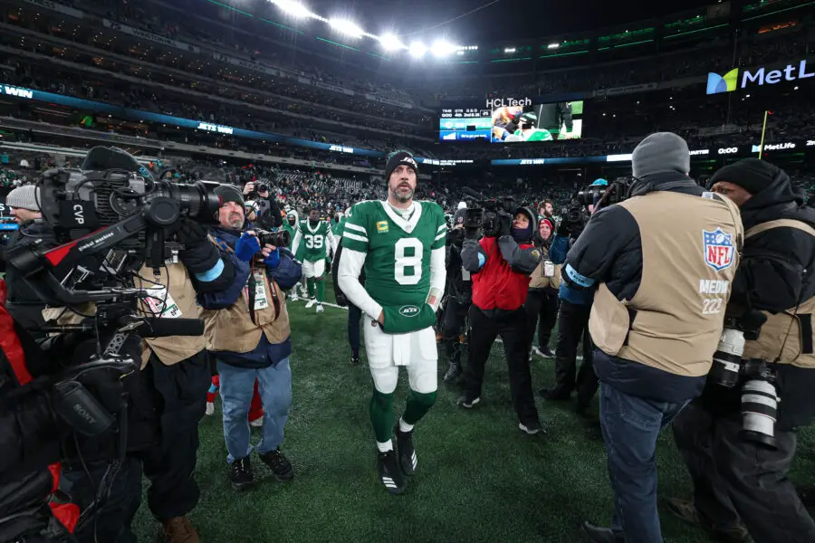 Jan 5, 2025; East Rutherford, New Jersey, USA; New York Jets quarterback Aaron Rodgers (8) walks on the field after the game against the Miami Dolphins at MetLife Stadium. Mandatory Credit: Vincent Carchietta-Imagn Images