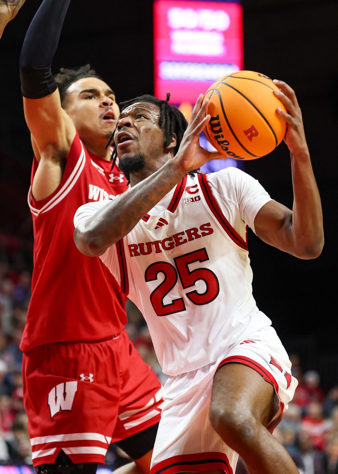 Wisconsin Basketball: Advanced Analytics Project Massive Conference Win For Badgers Against Big Ten Hopeful Rutgers Scarlet Knights. Jeremiah Williams (25) drives to the basket against Wisconsin Badgers guard John Tonje (9)