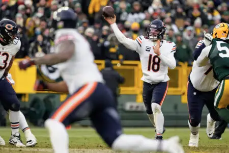 Jan 5, 2025; Green Bay, Wisconsin, USA; Chicago Bears quarterback Caleb Williams (18) during the game against the Green Bay Packers at Lambeau Field. Mandatory Credit: Jeff Hanisch-Imagn Images