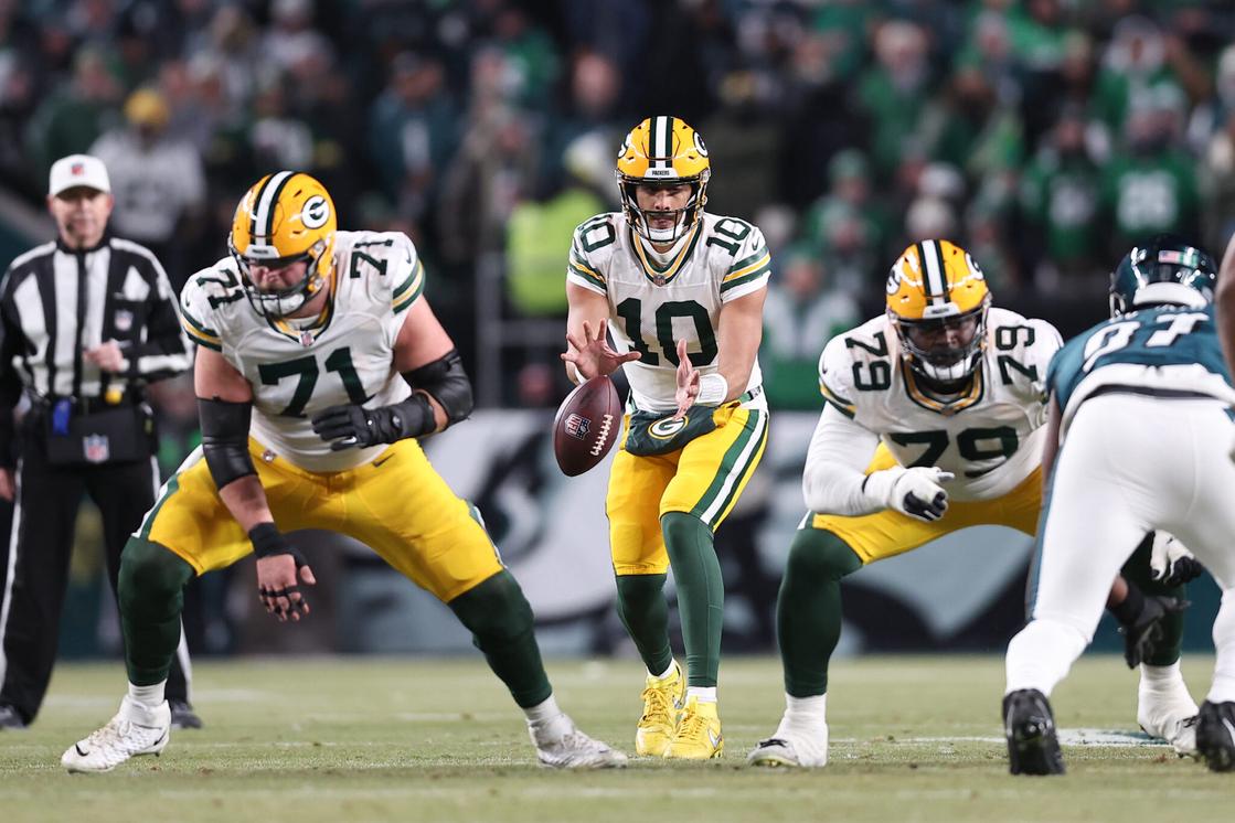 Jan 12, 2025; Philadelphia, Pennsylvania, USA; Green Bay Packers quarterback Jordan Love (10) and center Josh Myers (71) in action against the Philadelphia Eagles in an NFC wild card game at Lincoln Financial Field. Mandatory Credit: Bill Streicher-Imagn Images