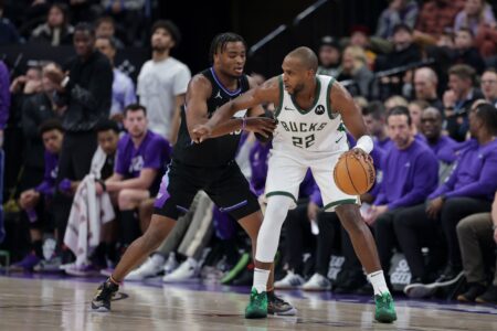 Milwaukee Bucks forward Khris Middleton (22) controling the ball as Utah Jazz guard Isaiah Collier (13) defending