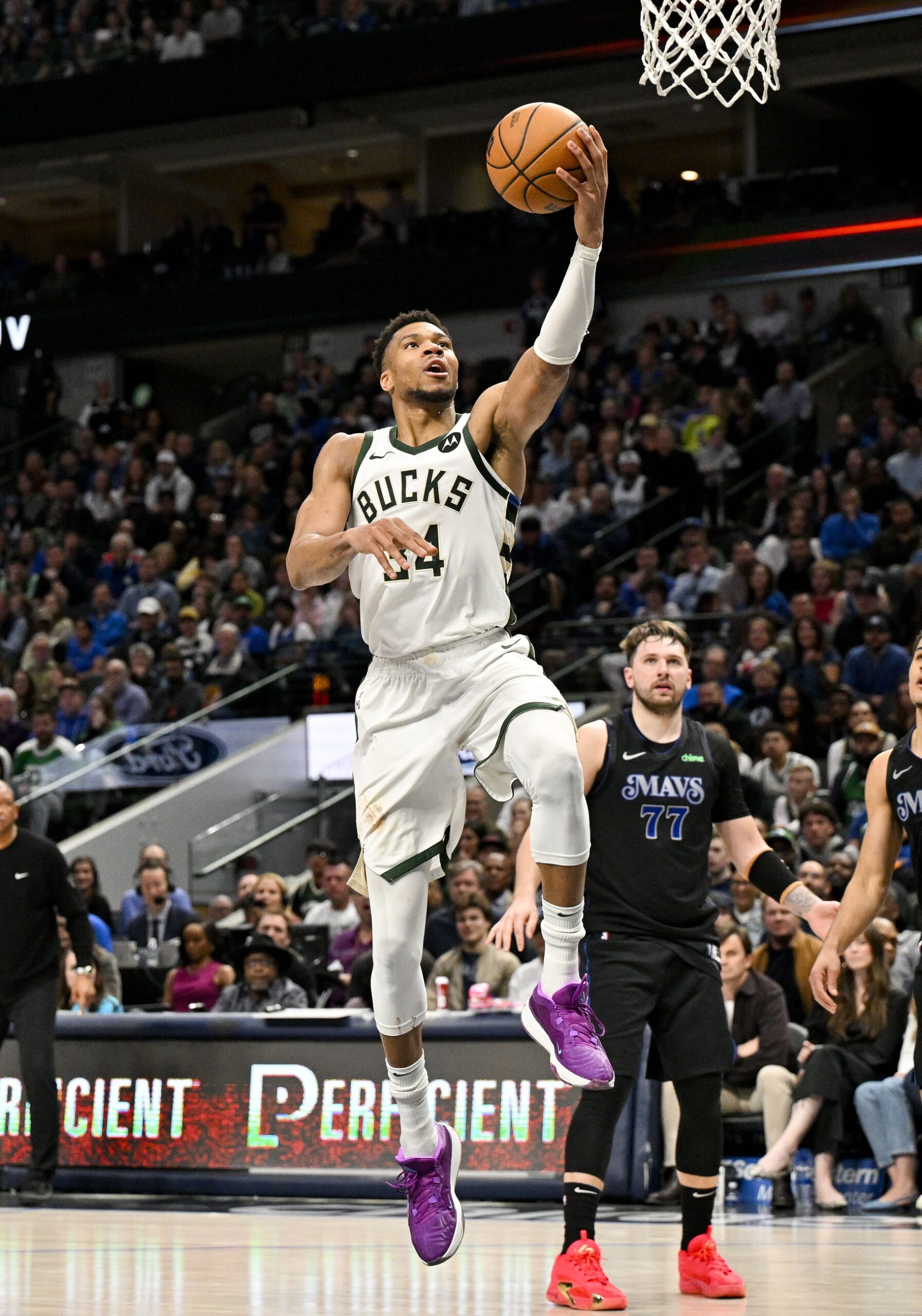 Feb 3, 2024; Dallas, Texas, USA; Milwaukee Bucks forward Giannis Antetokounmpo (34) and Dallas Mavericks guard Luka Doncic (77) in action during the game between the Dallas Mavericks and the Milwaukee Bucks at the American Airlines Center. Mandatory Credit: Jerome Miron-USA TODAY Sports