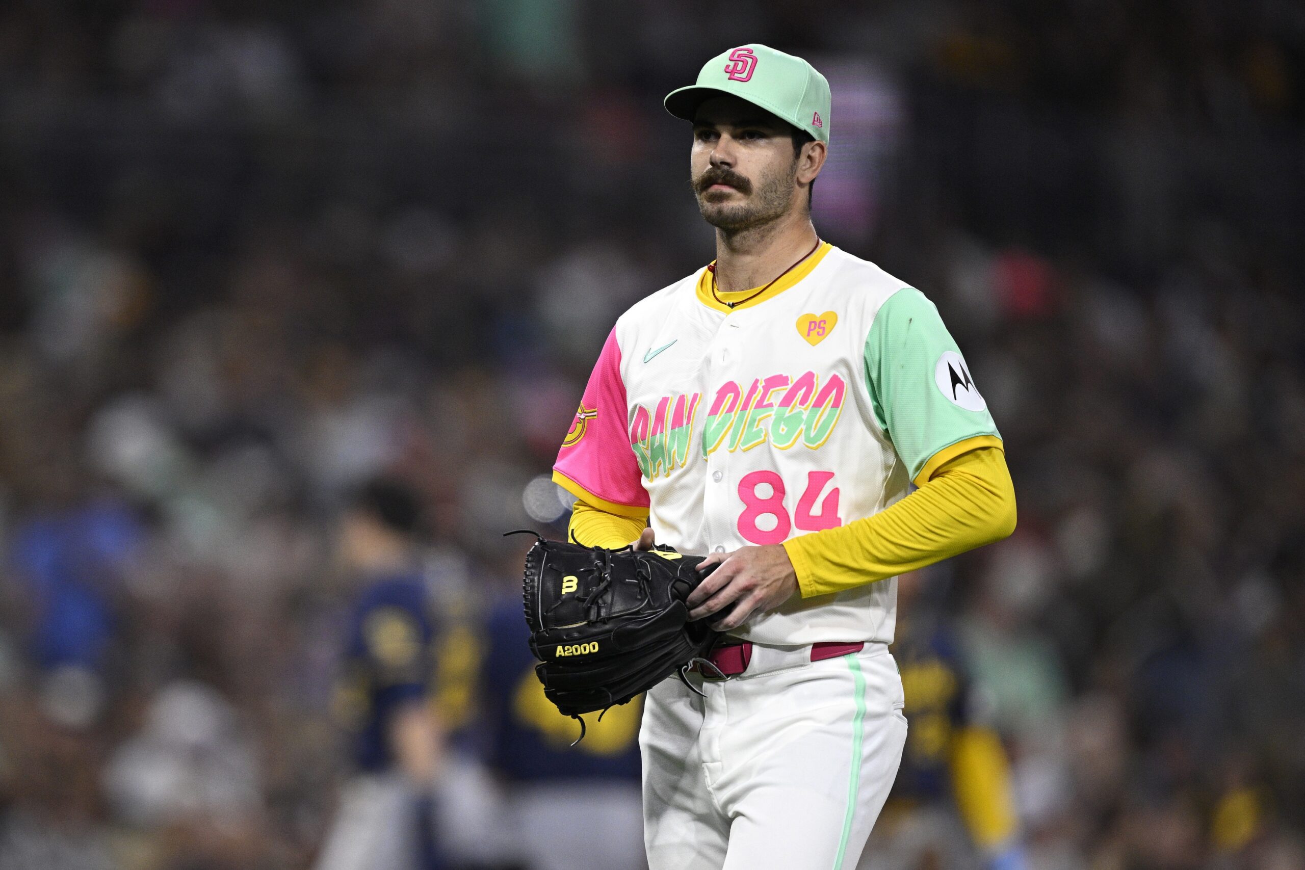 Jun 21, 2024; San Diego, California, USA; San Diego Padres starting pitcher Dylan Cease (84) walks to the dugout after a pitching change during the fifth inning against the Milwaukee Brewers at Petco Park. Mandatory Credit: Orlando Ramirez-Imagn Images