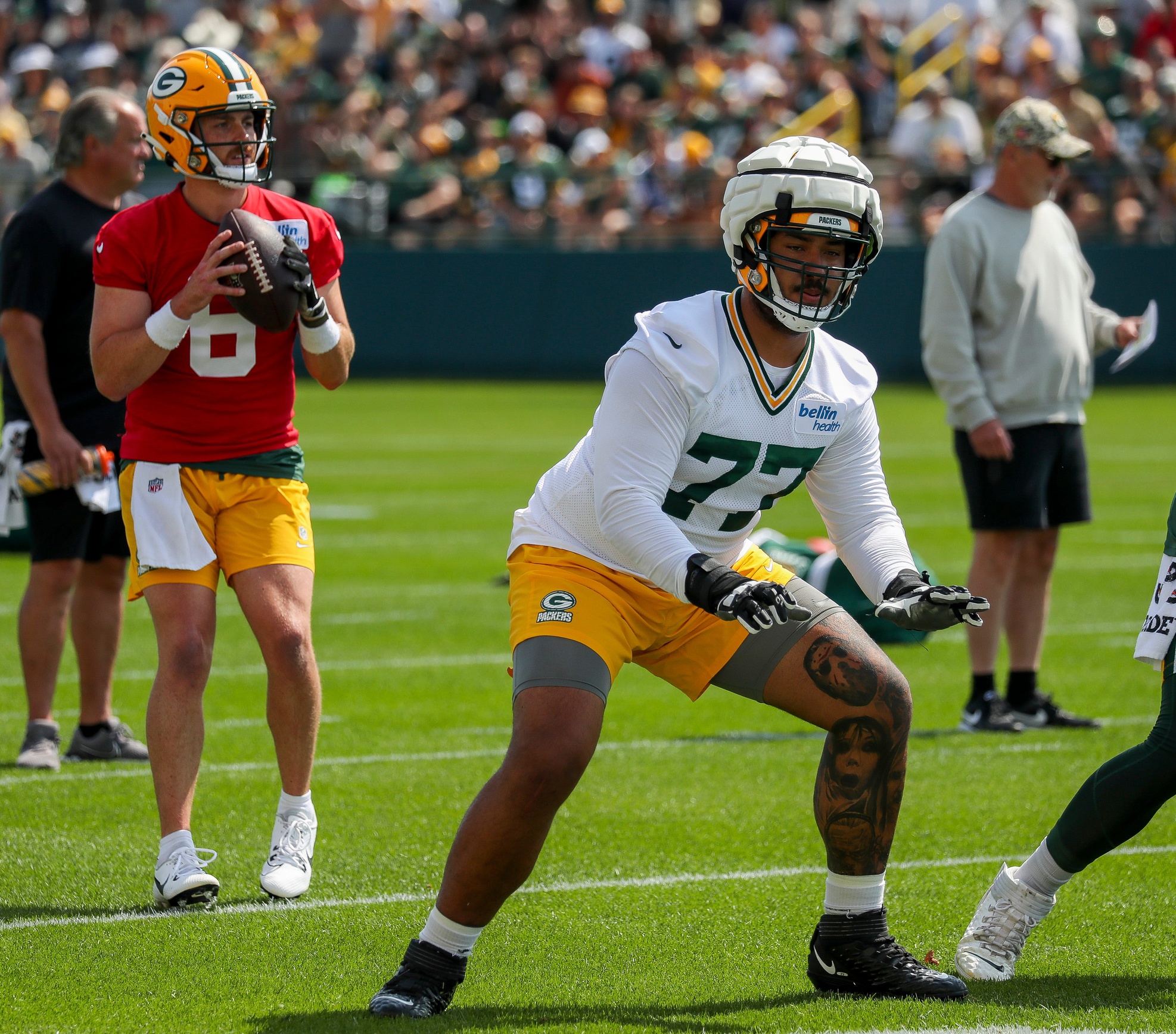 Green Bay Packers offensive lineman Jordan Morgan (77) runs through individual drills during the first day of training camp on Monday, July 22, 2024, at Ray Nitschke Field in Green Bay, Wis. Tork Mason/USA TODAY NETWORK-Wisconsin