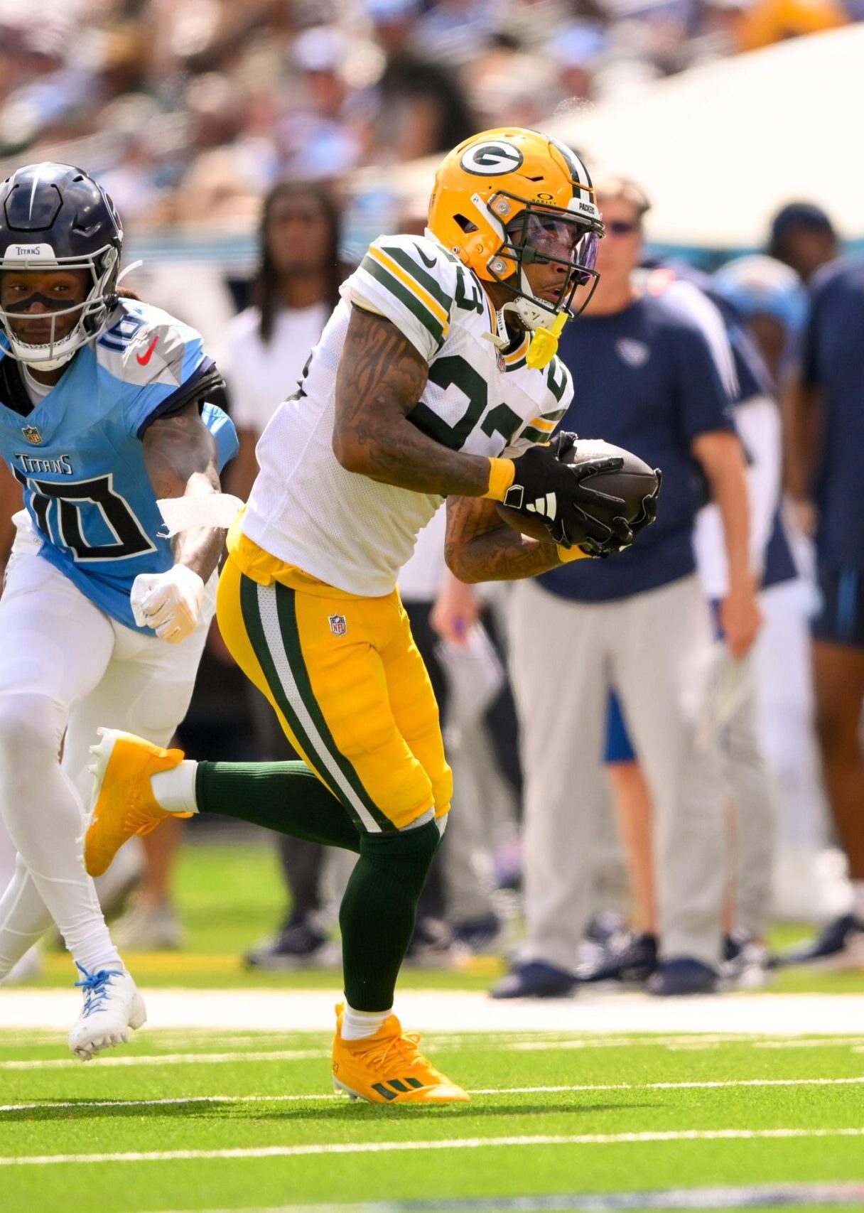 Green Bay Packers cornerback Jaire Alexander (23) intercepts a pass thrown by Tennessee Titans Will Levis (8)