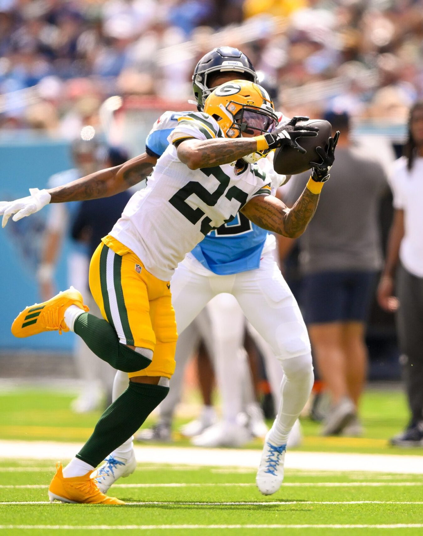 Sep 22, 2024; Nashville, Tennessee, USA; Green Bay Packers cornerback Jaire Alexander (23) intercepts a pass thrown by Tennessee Titans Will Levis (8) during the first half at Nissan Stadium. Mandatory Credit: Steve Roberts-Imagn Images