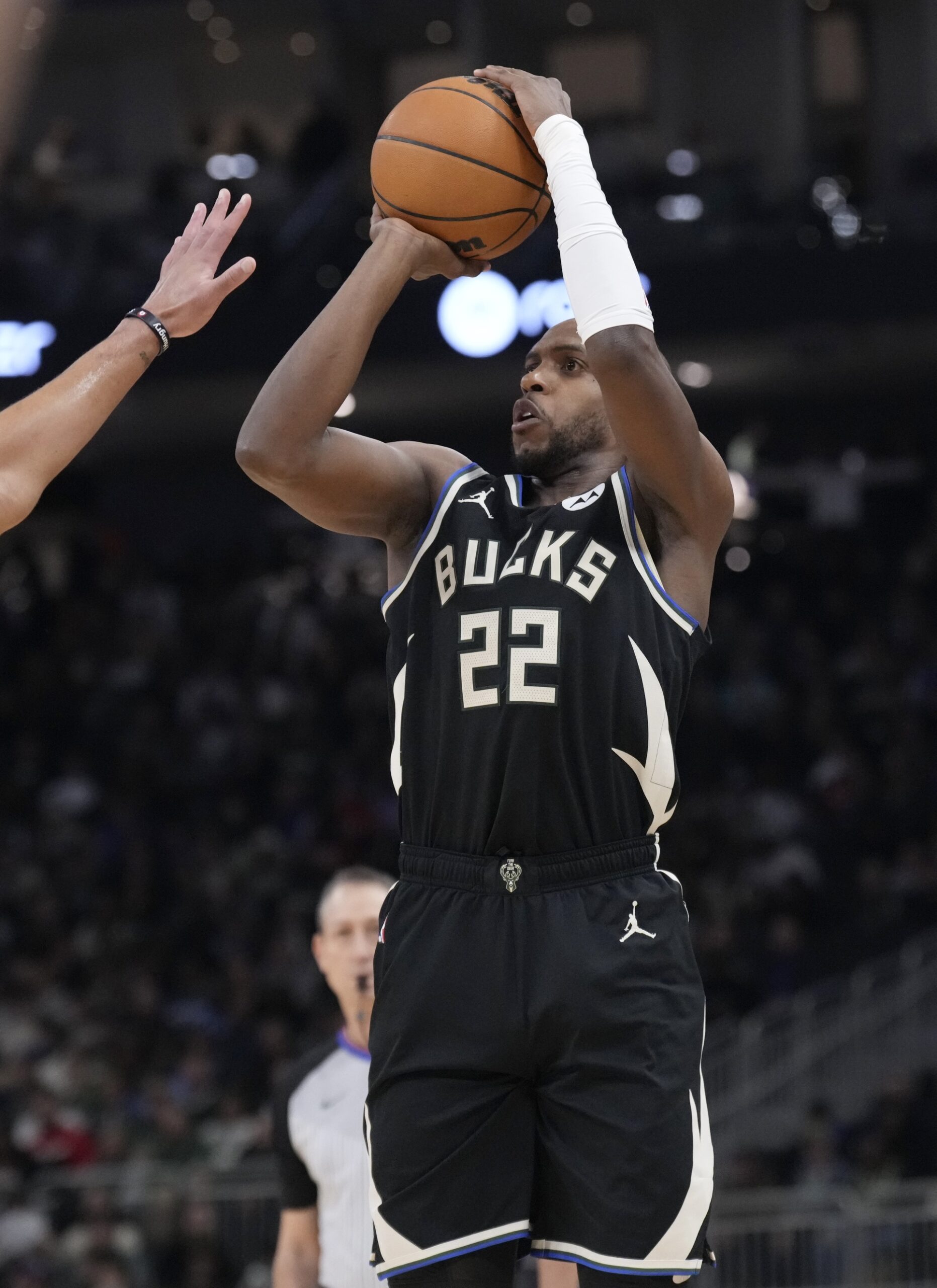 Milwaukee Bucks forward Khris Middleton (22) puts up a shot against the Memphis Grizzlies