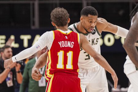 Milwaukee Bucks forward Giannis Antetokounmpo (34) reacts with Atlanta Hawks guard Trae Young (11), Washington Wizards