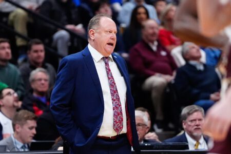 Mar 20, 2025; Denver, CO, USA; Wisconsin Badgers head coach Greg Gard looks on during the first half against the Montana Grizzlies in the first round of the NCAA Tournament at Ball Arena. Mandatory Credit: Ron Chenoy-Imagn Images