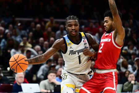 Marquette Golden Eagles (7) Can’t Hold Lead, Lose to New Mexico Lobos (10) 75-66 in First Round of NCAA Men’s Championship Kam Jones (1) plays the ball defended by New Mexico Lobos guard Donovan Dent (2)