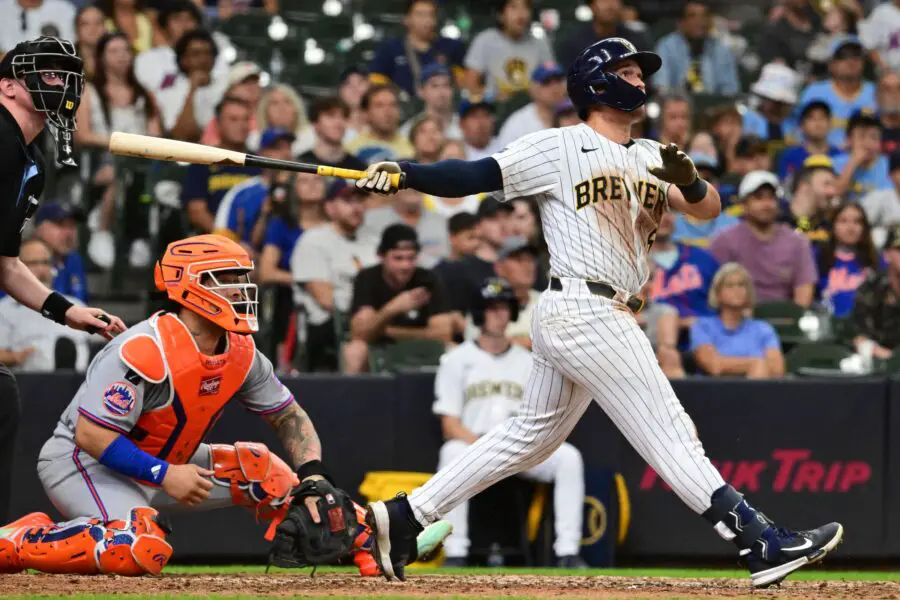 Aug 10, 2025; Milwaukee, Wisconsin, USA; Milwaukee Brewers left fielder Isaac Collins (6) hits a walk off home run in the ninth inning in front of New York Mets catcher Luis Torrens (13) at American Family Field. Mandatory Credit: Benny Sieu-Imagn Images