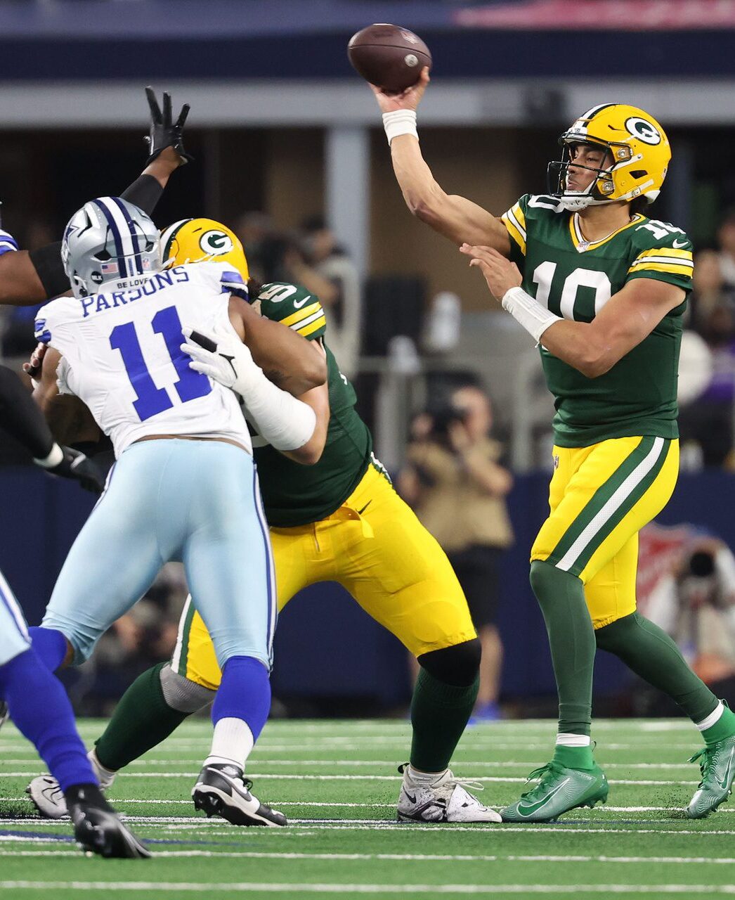 Jan 14, 2024; Arlington, Texas, USA; Green Bay Packers quarterback Jordan Love (10) drops back to pass against the Dallas Cowboys in the first half of the 2024 NFC wild card game at AT&T Stadium. Mandatory Credit: Kevin Jairaj-Imagn Images